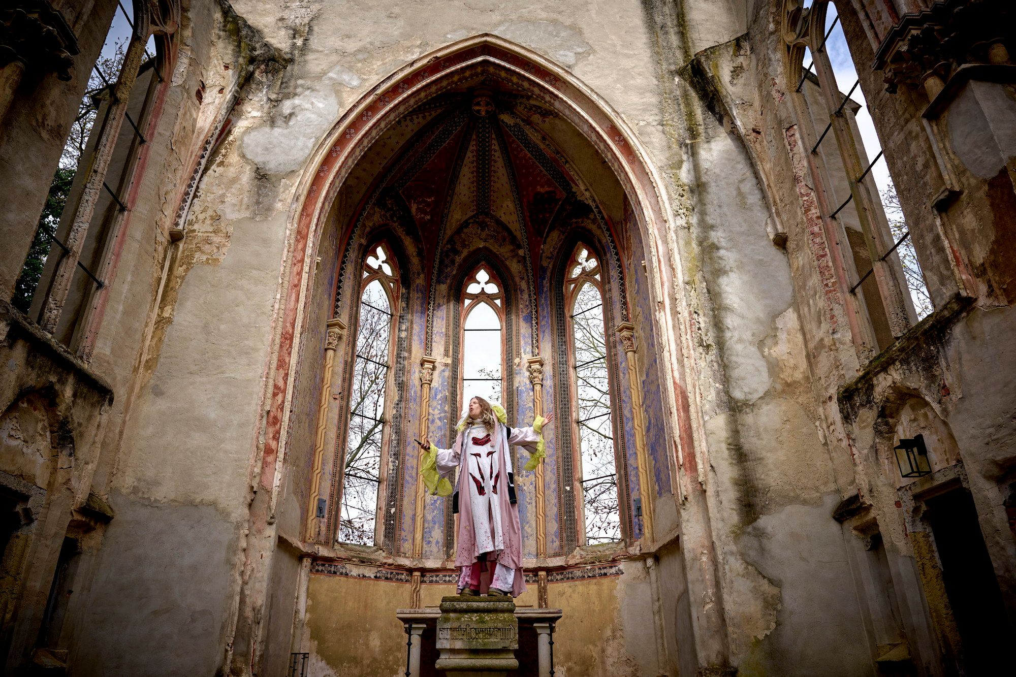 Ritual performance by Giek in a historic church space exploring mythic memory and symbolic consciousness